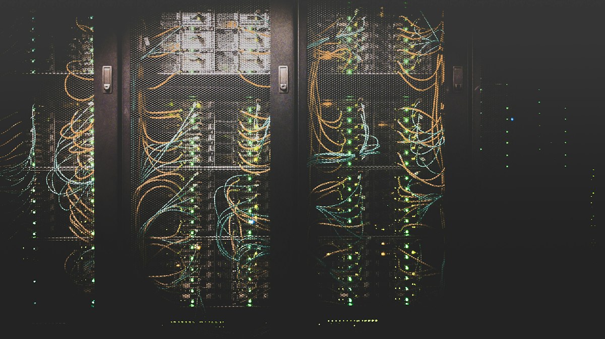 Server cabinets with network cables and illuminated status lights